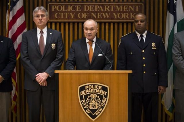 NYPD Commissioner Ray Kelly speaks to the media during a news conference alongside Chief of Detectives Phil Pulaski, left, and Chief of Department Philip Banks 